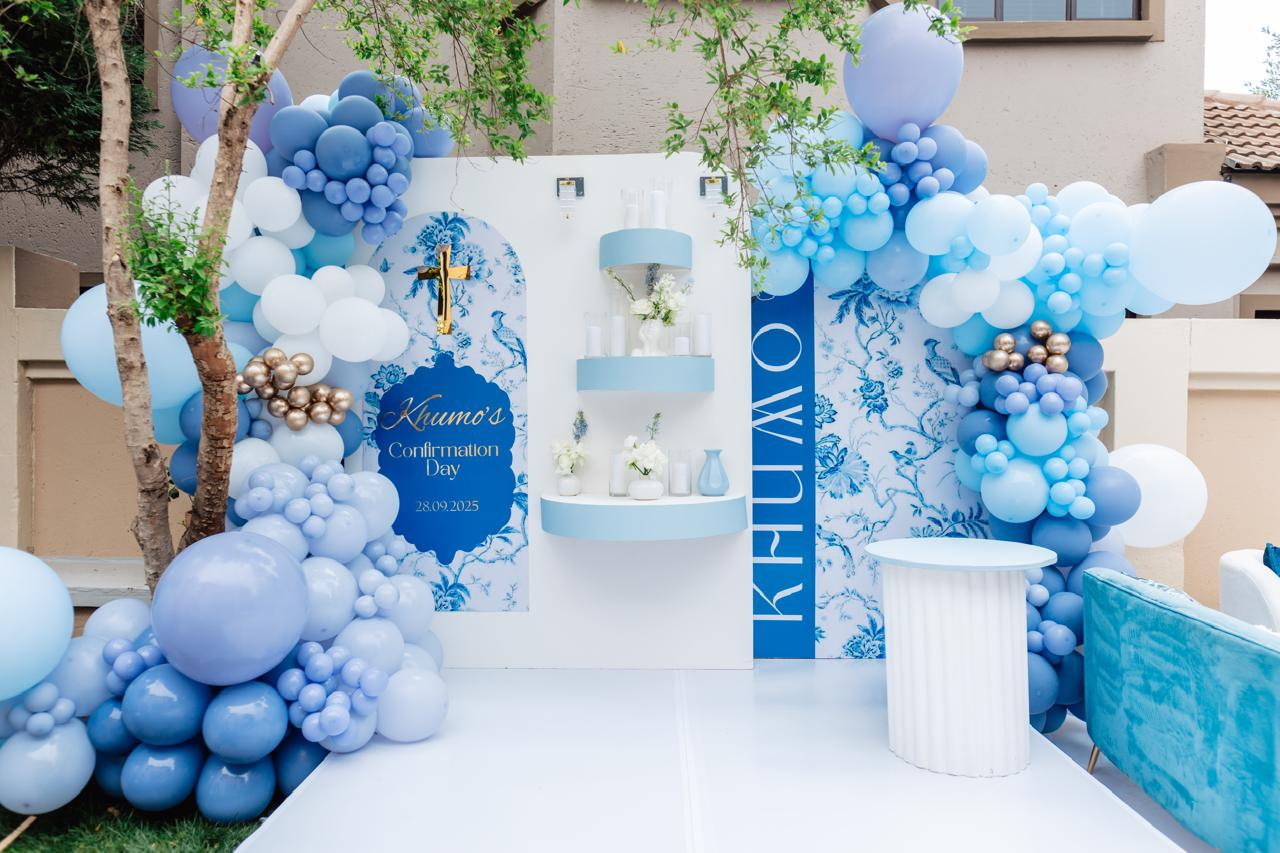 Blue and white confirmation celebration setup with balloon installation